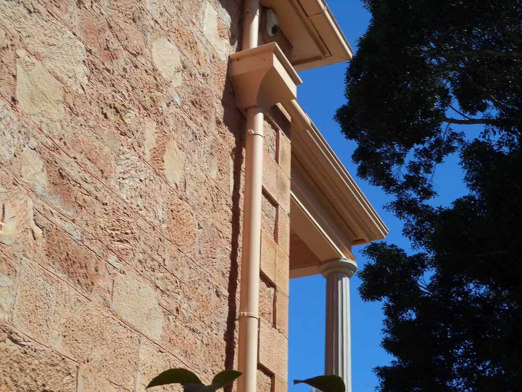 Roofline guttering and downpipe detail